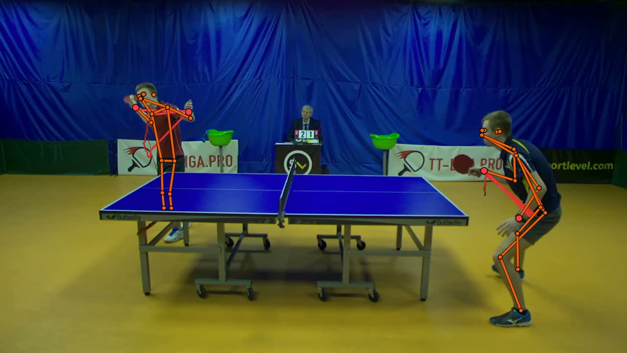 A side-on view of a table tennis match, both players and the whole table in frame.